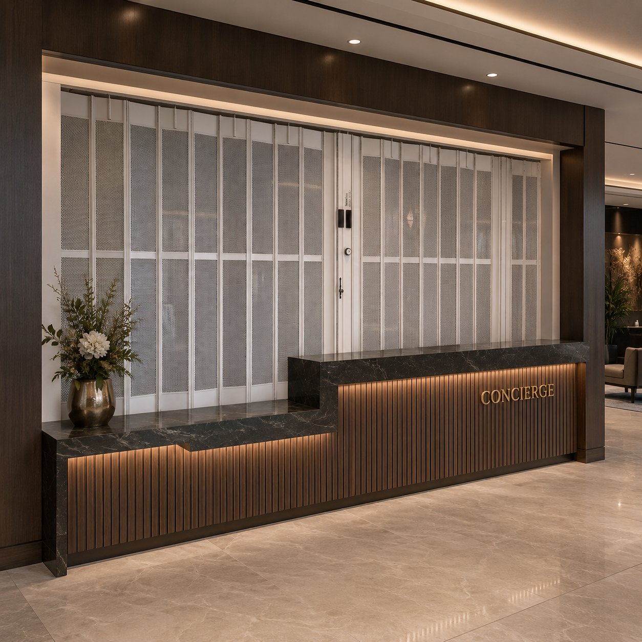 Modern hotel concierge desk with marble countertop and decorative security grilles.